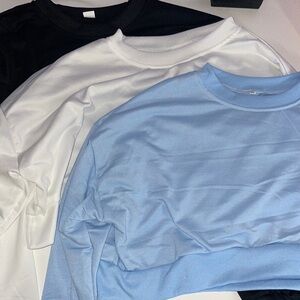 3 pack of brand new cropped sweaters new without tags. Black white and blue.